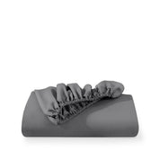 A fitted sheet folded neatly with the all around elastic showing