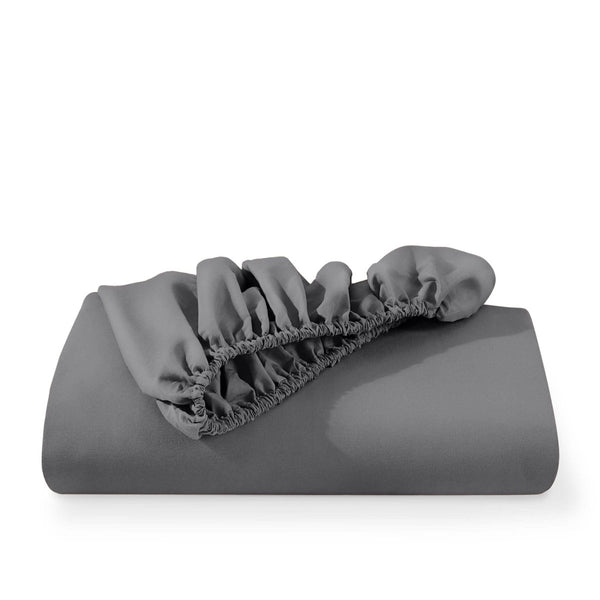 A fitted sheet folded neatly with the all around elastic showing