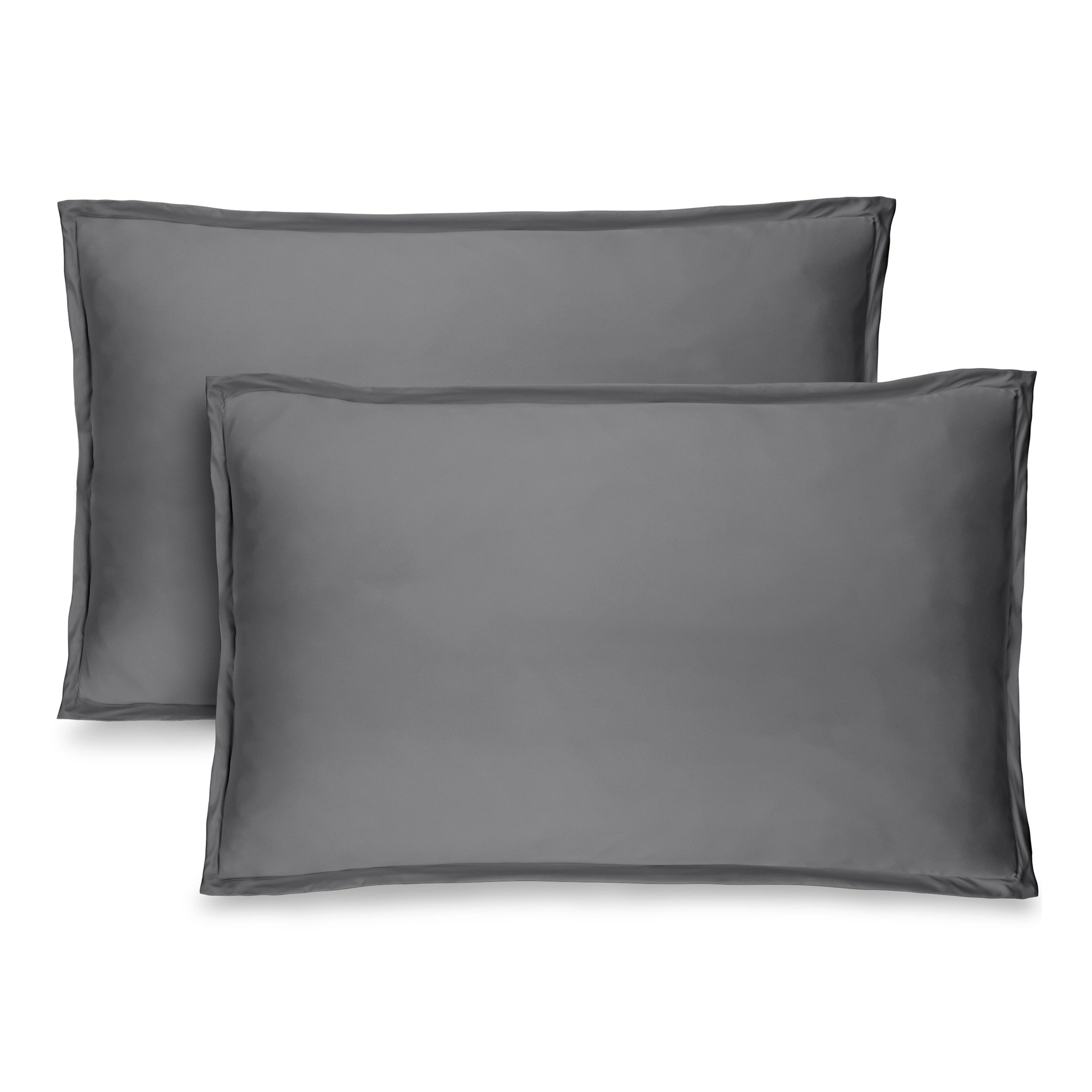 Two grey pillow shams on pillows standing up with one behind the other