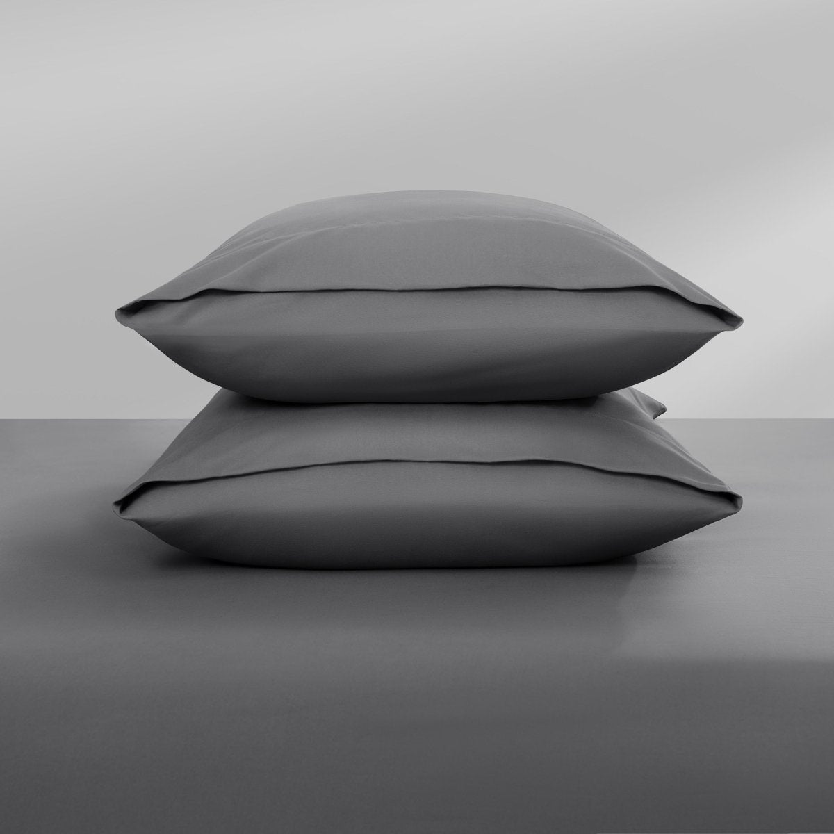 Two pillowcases on top of a bed
