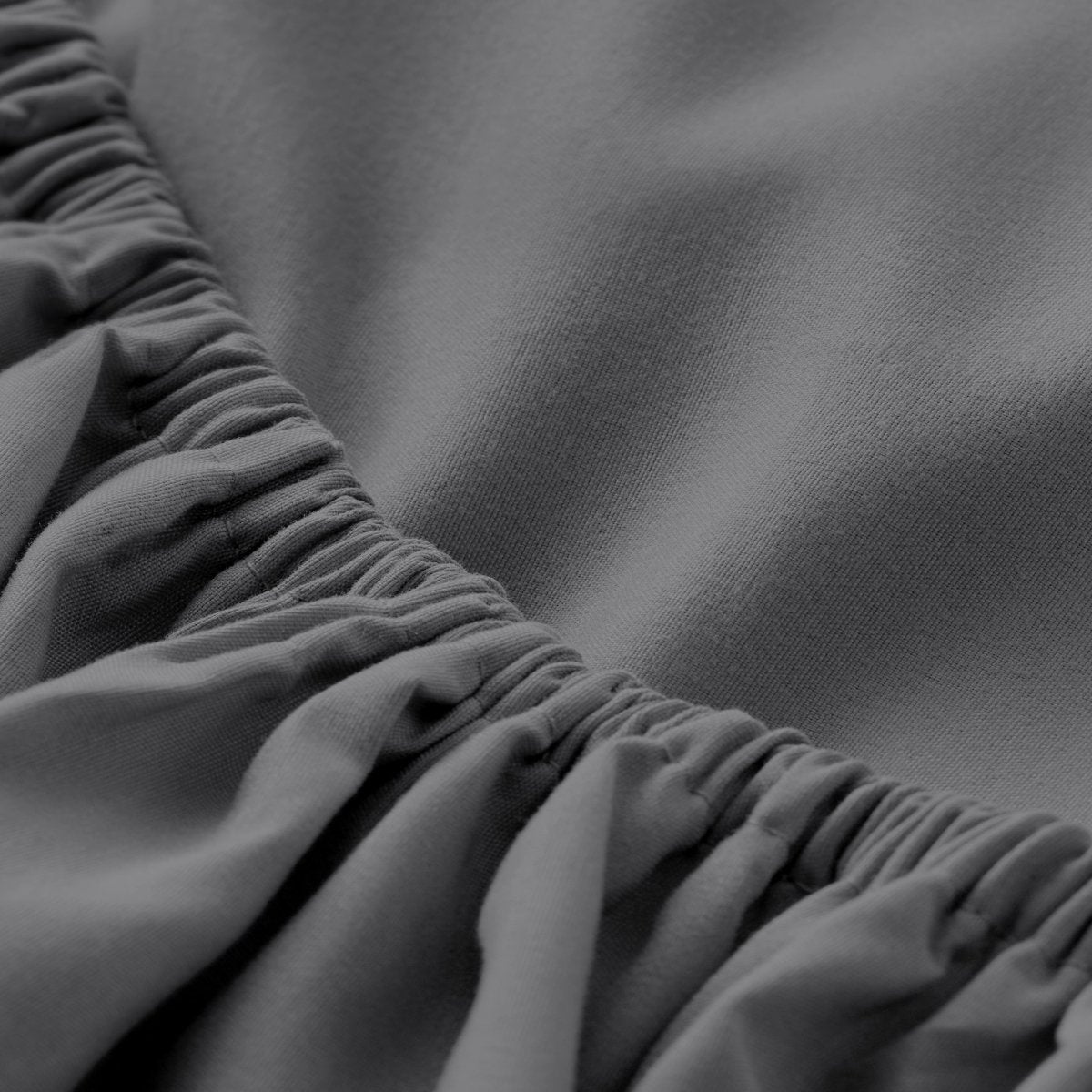 Close-up of elastic on a fitted sheet.