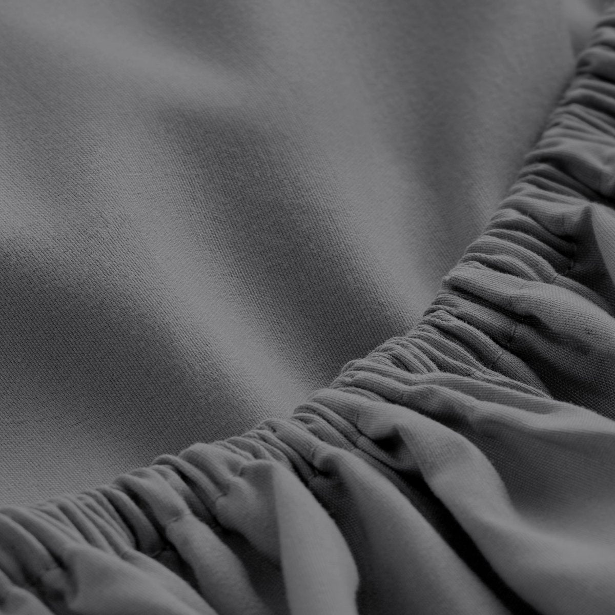 Close-up of fitted sheet showing the all around elastic