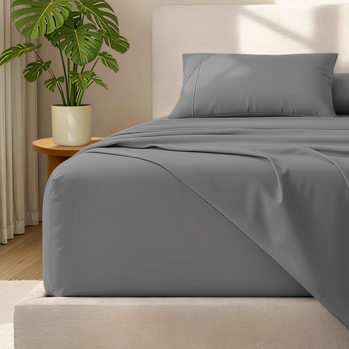 Bed with microfiber bedding and wooden headboard in a bedroom setting