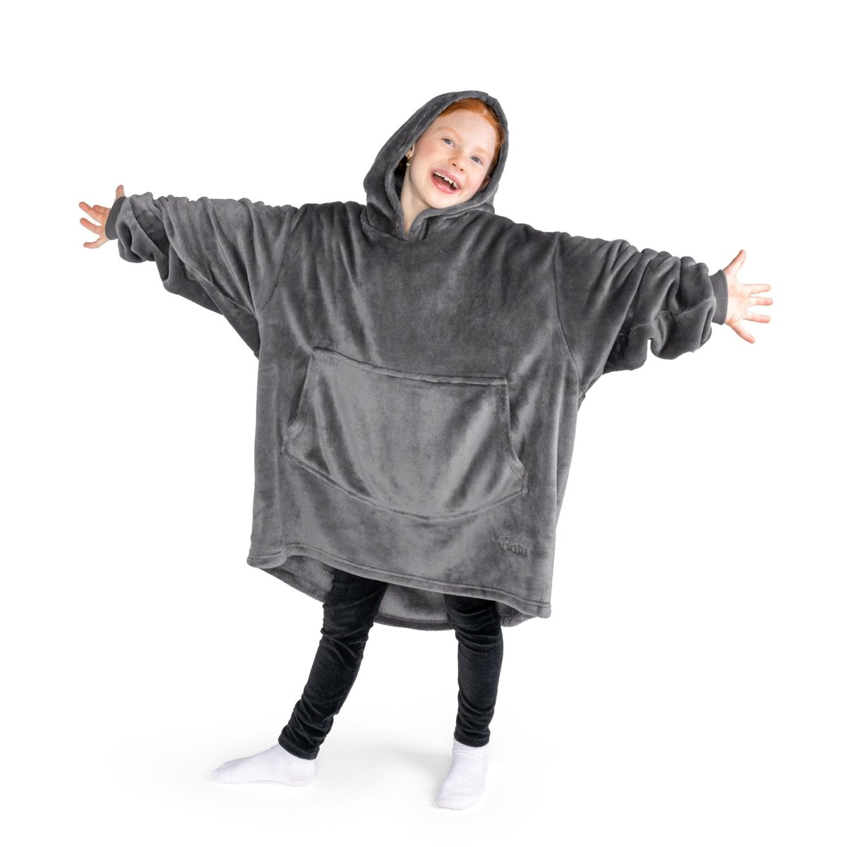 A child has a hooded microplush wearable blanket on and her arms are stretched out