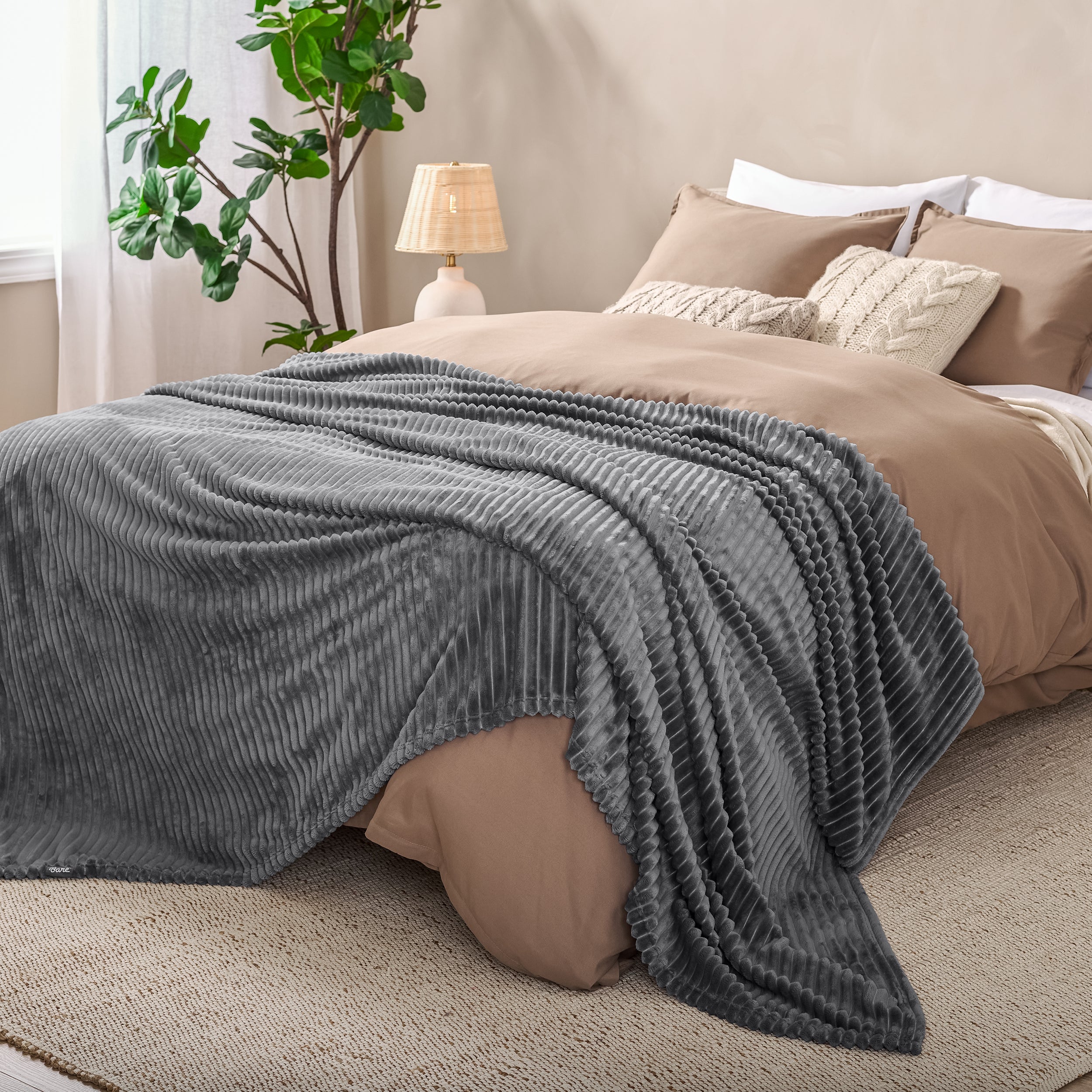 Microplush ribbed blanket on a bed