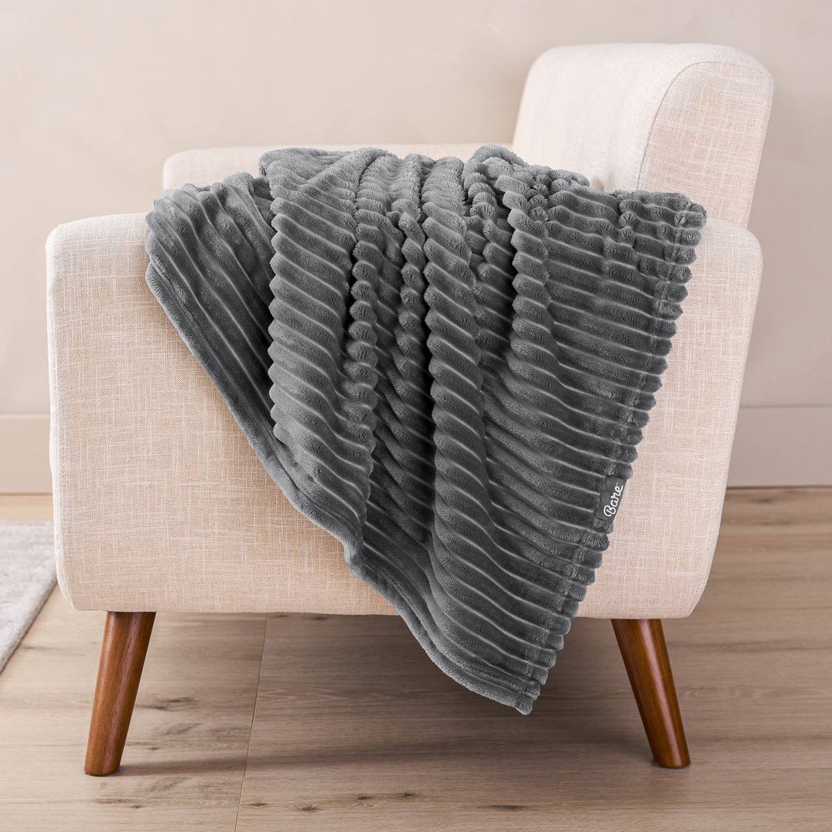 A microplush blanket draped over a chair