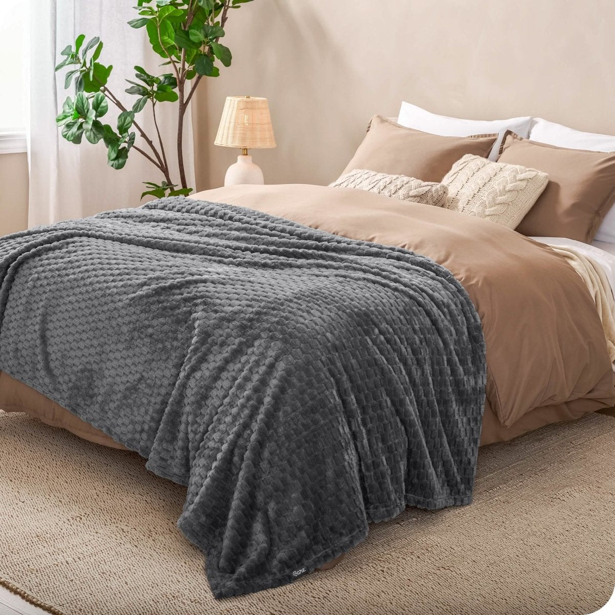 Microplush waffle blanket on a bed