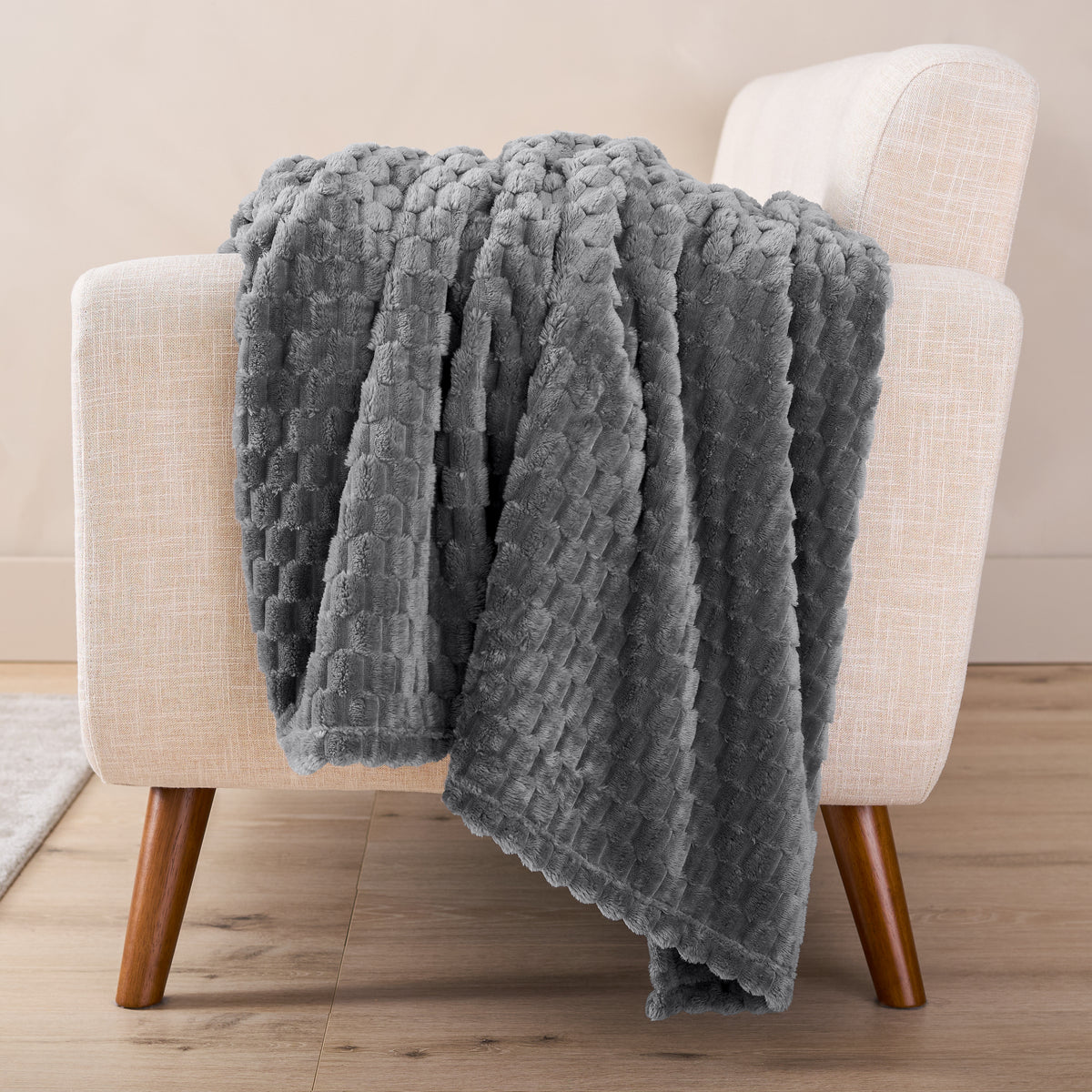 A microplush blanket draped over a chair