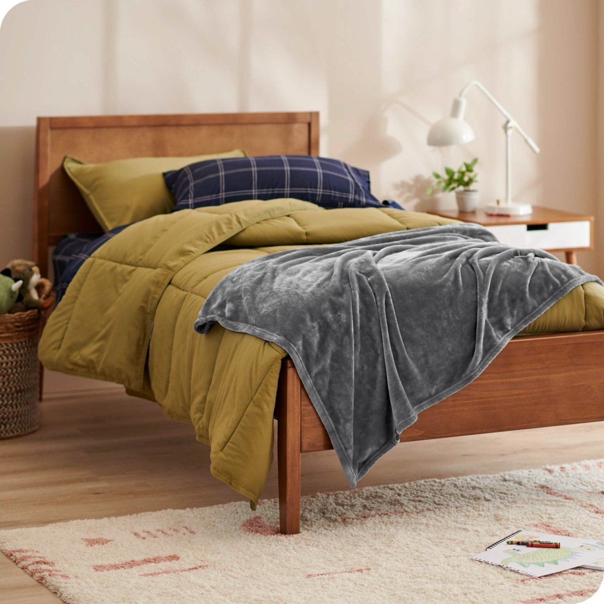 A microplush blanket on a kid's bed