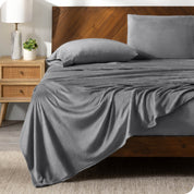 A microplush sheet set on a bed in a modern bedroom.