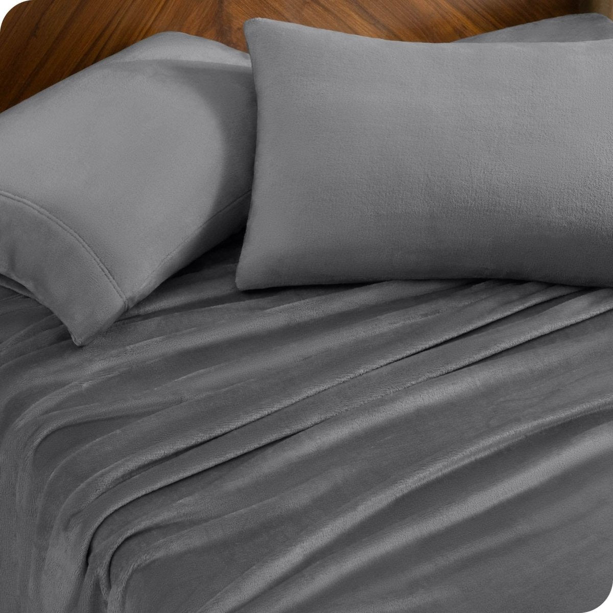A sheet set and matching pillowcases on a bed.
