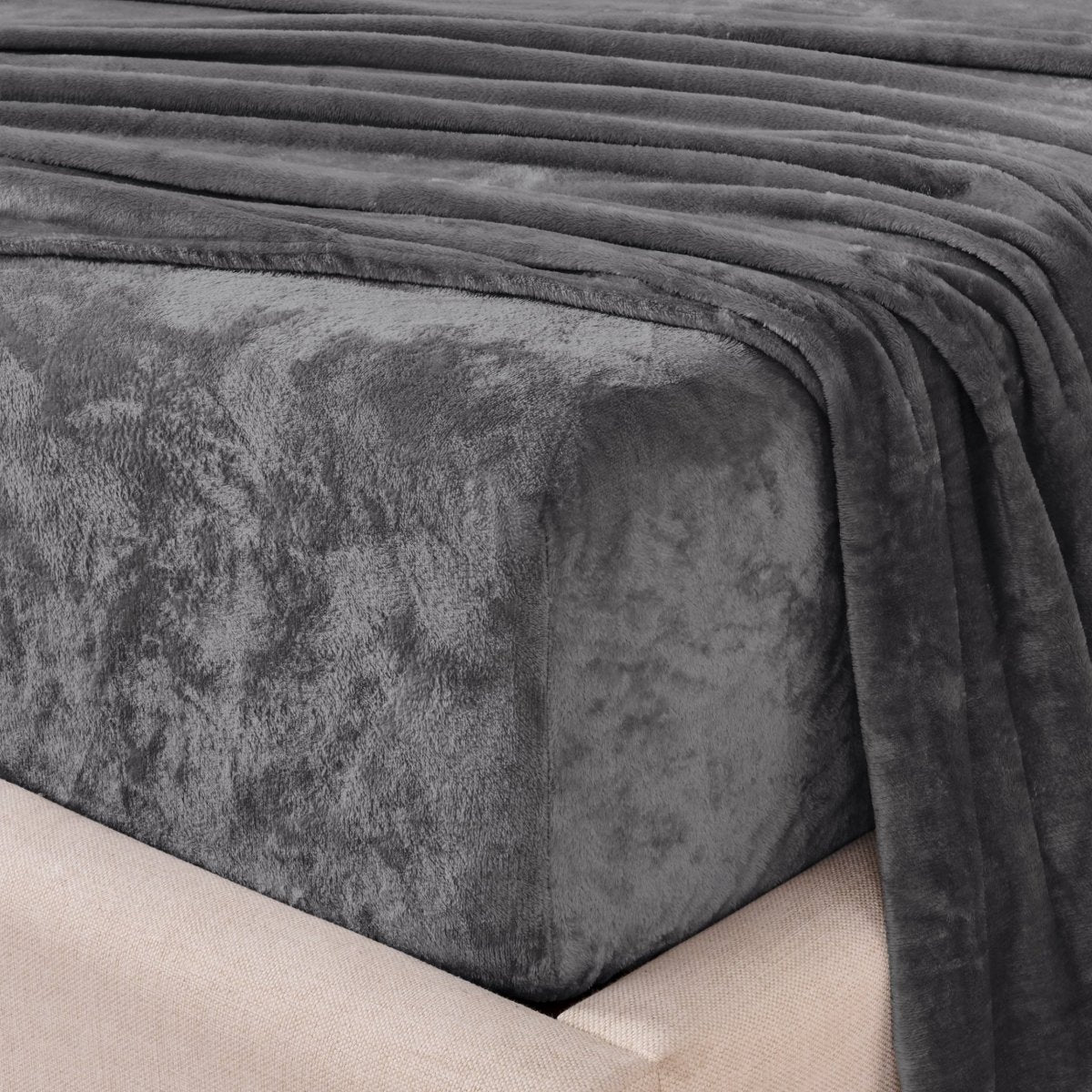 Close-up of the corner of a bed made with microplush sheets