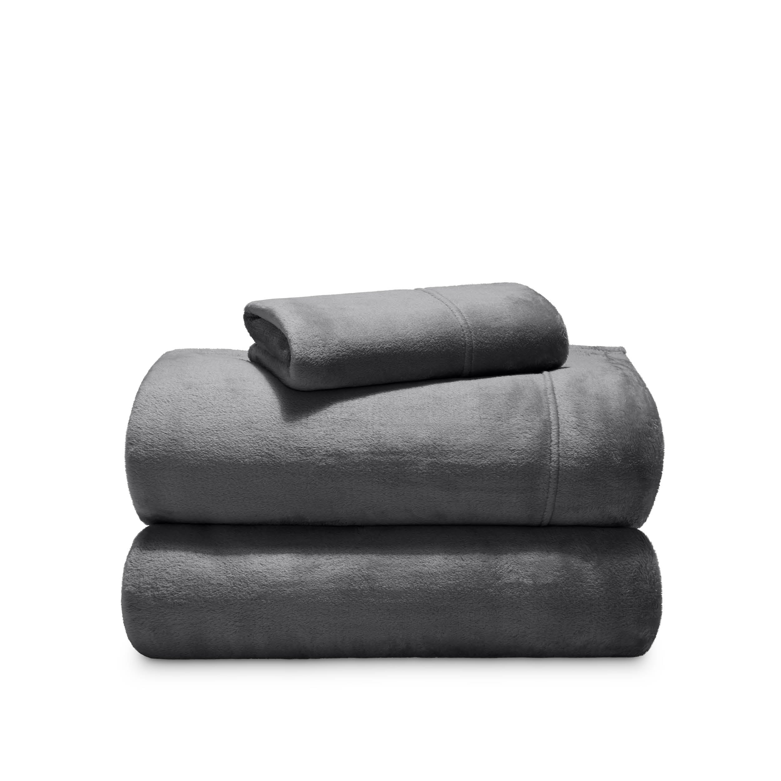 Stack of microplush sheets on a white background