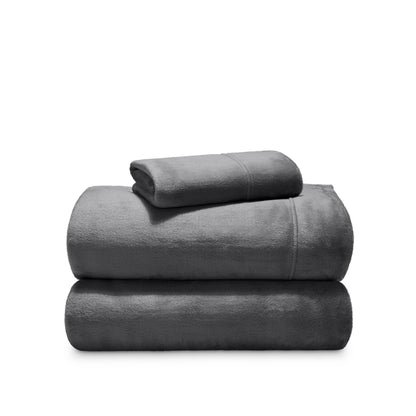 Stack of microplush sheets on a white background