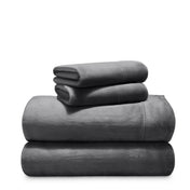 Stack of microplush sheets on a white background