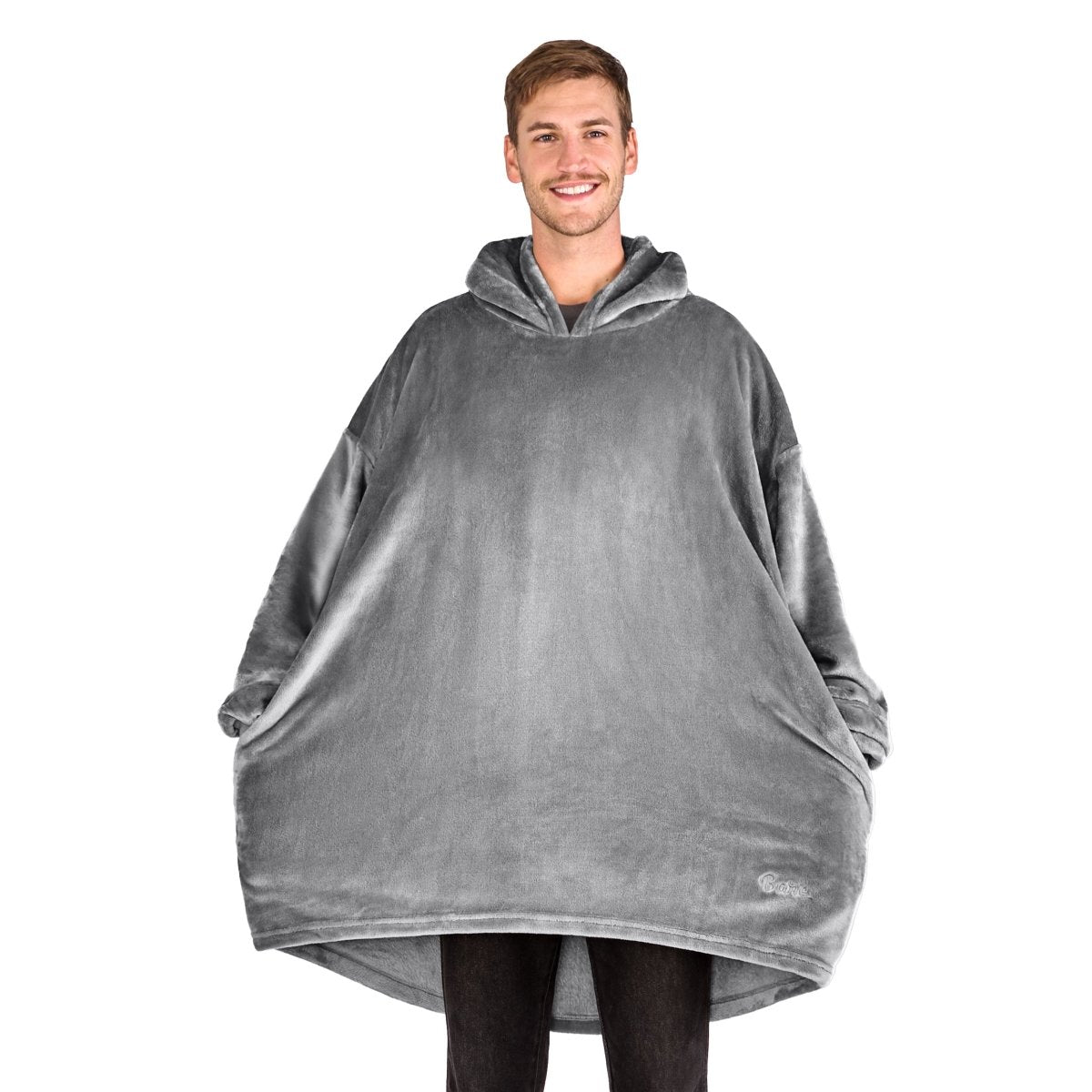 A man standing with a wearable blanket on