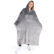 An adult with long microplush wearable blanket on
