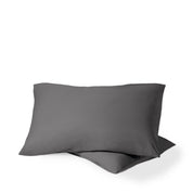 Two pillows with percale pillowcases on them