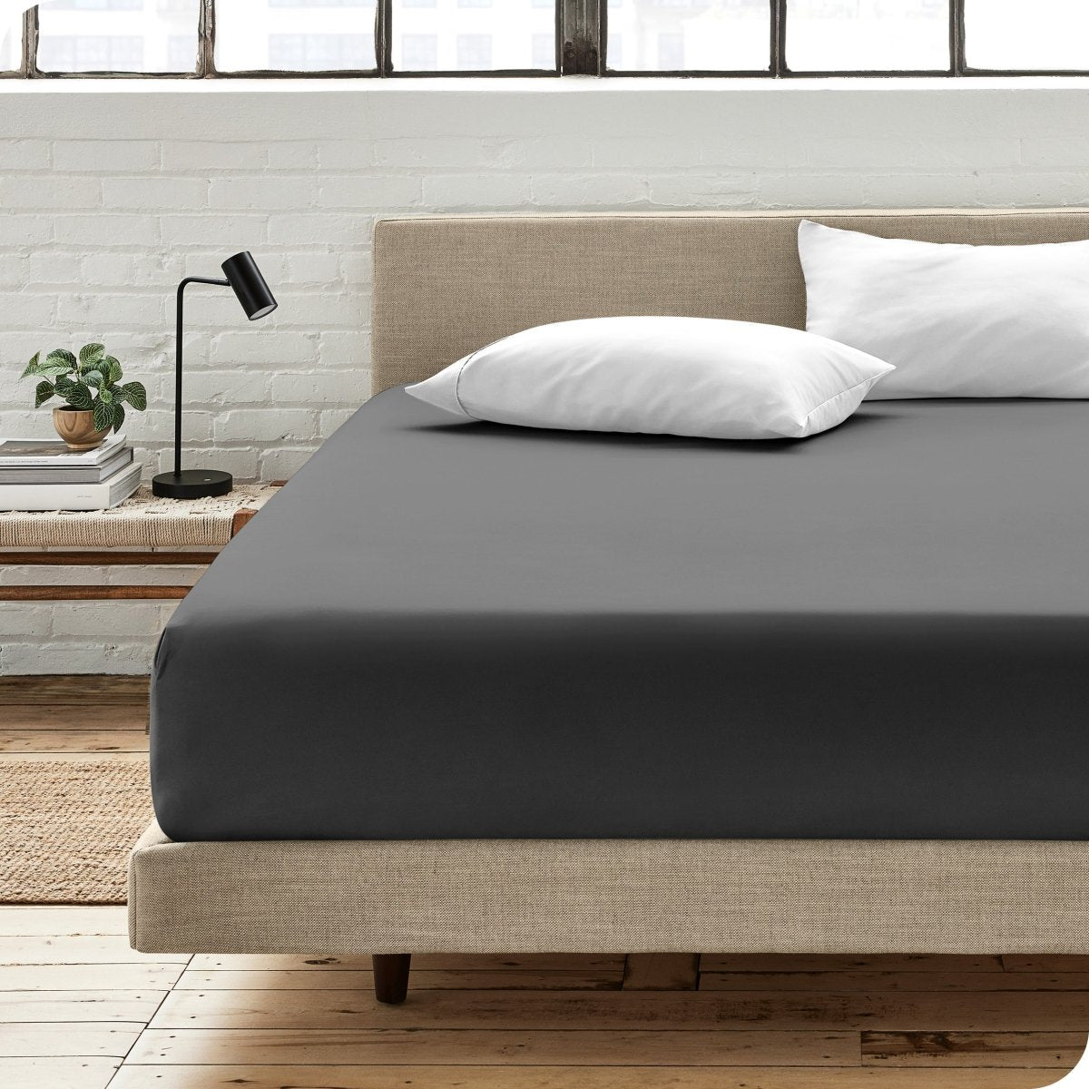 Bedroom scene with organic cotton fitted sheet and pillowcases on a bed