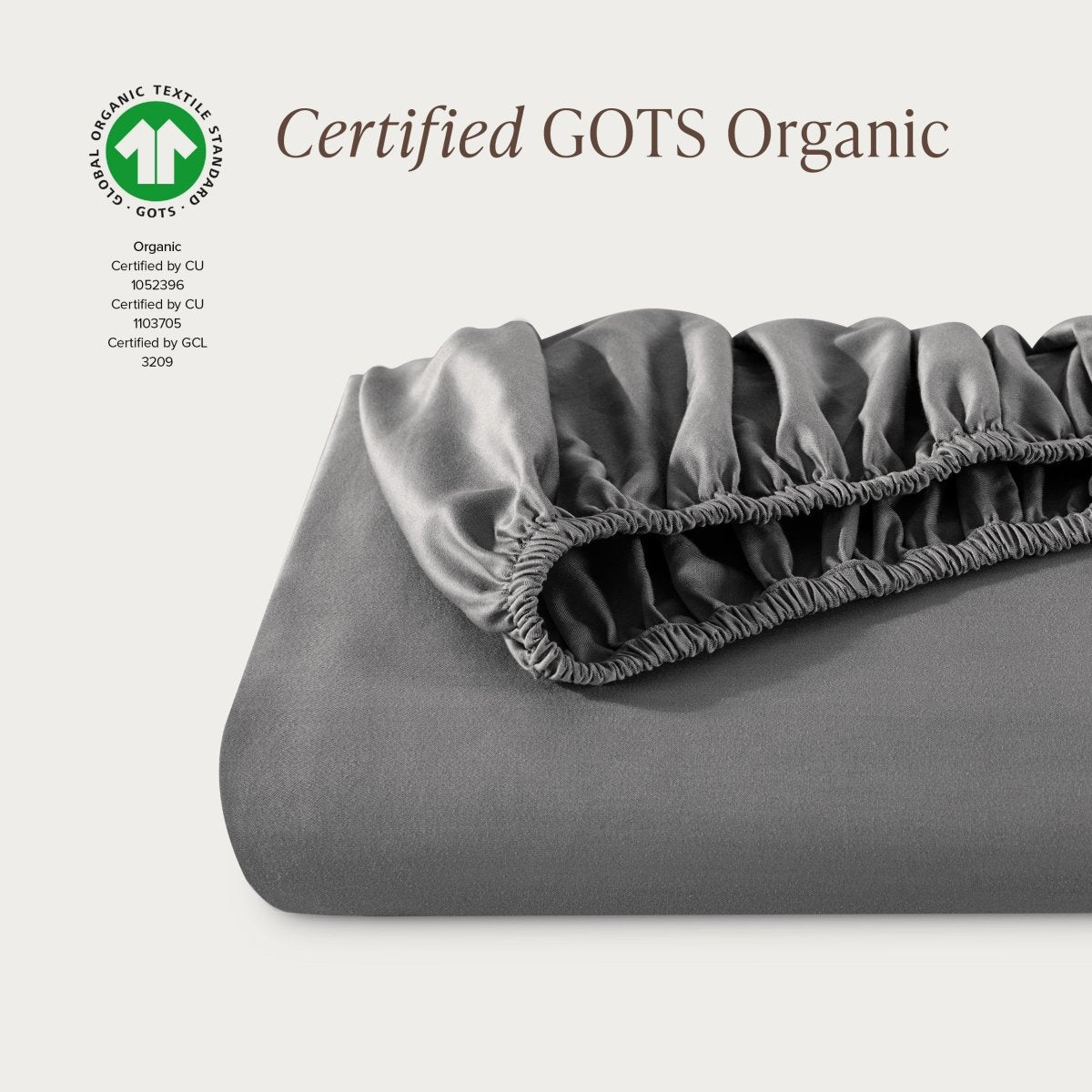 Certified GOTS Organic fitted sheet on a light gray background