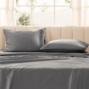 Pillows on a bed with in a bright room.