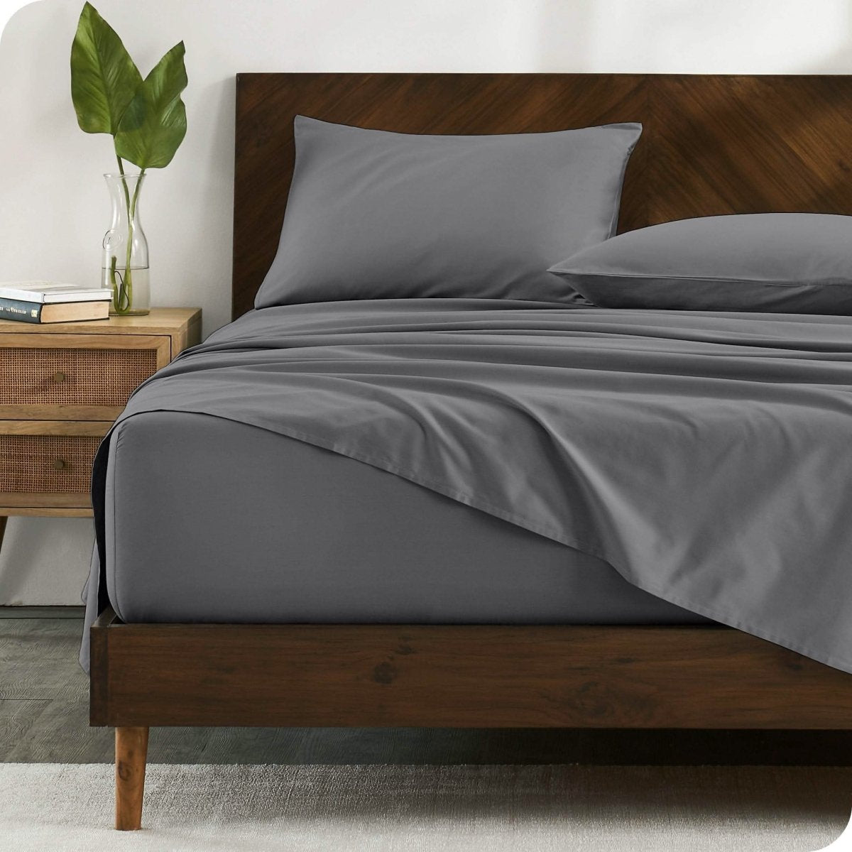 A bed made with organic cotton sateen sheets