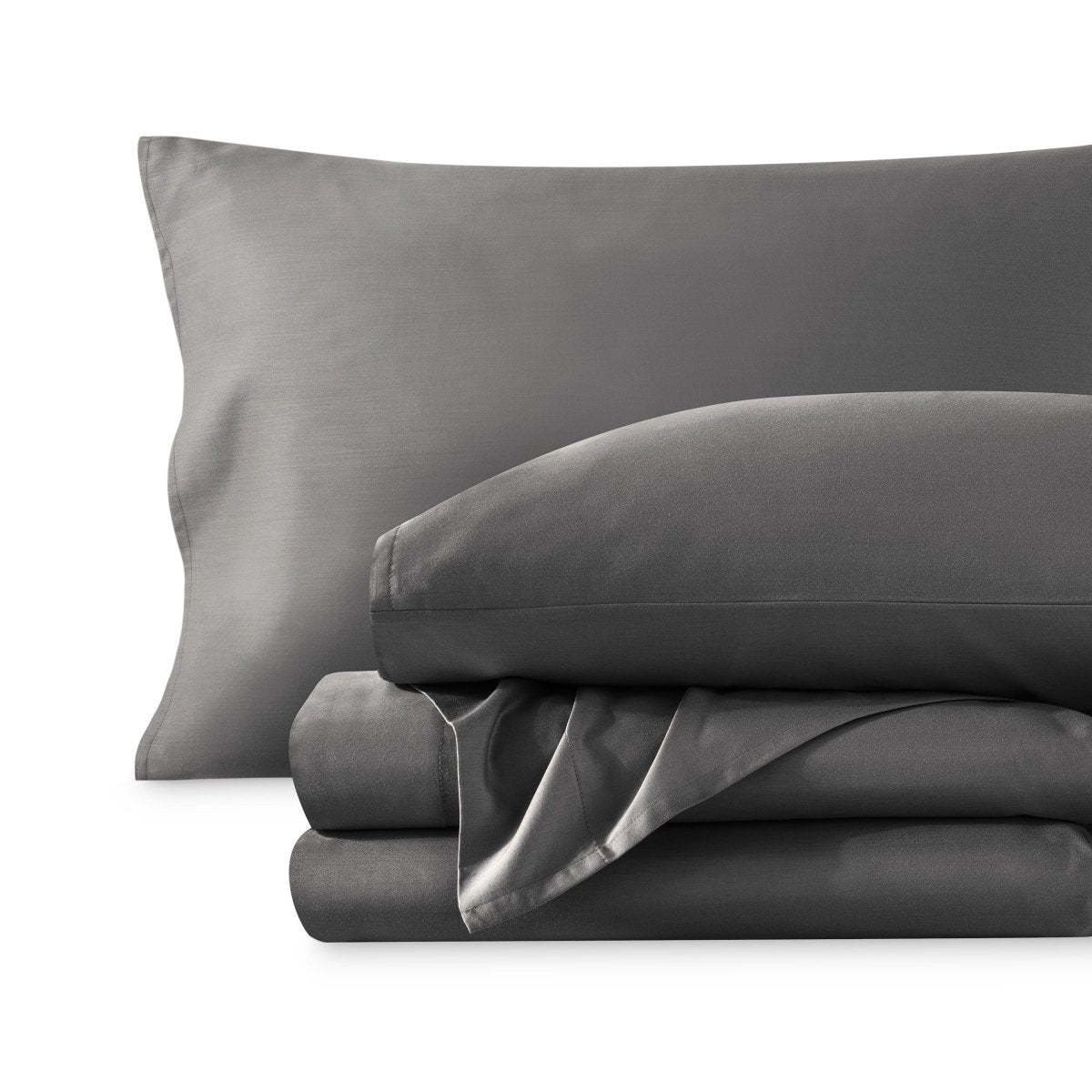 A sateen sheet set folded and stacked on a white background.