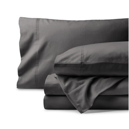 Organic flannel bed sheets and pillowcase set on a white background
