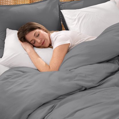 Woman sleeping peacefully under organic jersey bedding