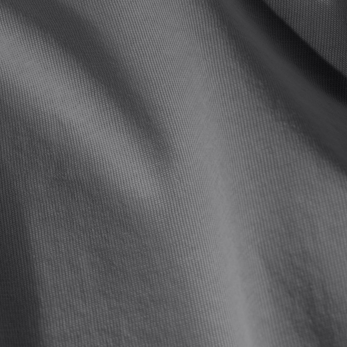 Close-up of organic cotton jersey fabric with subtle texture
