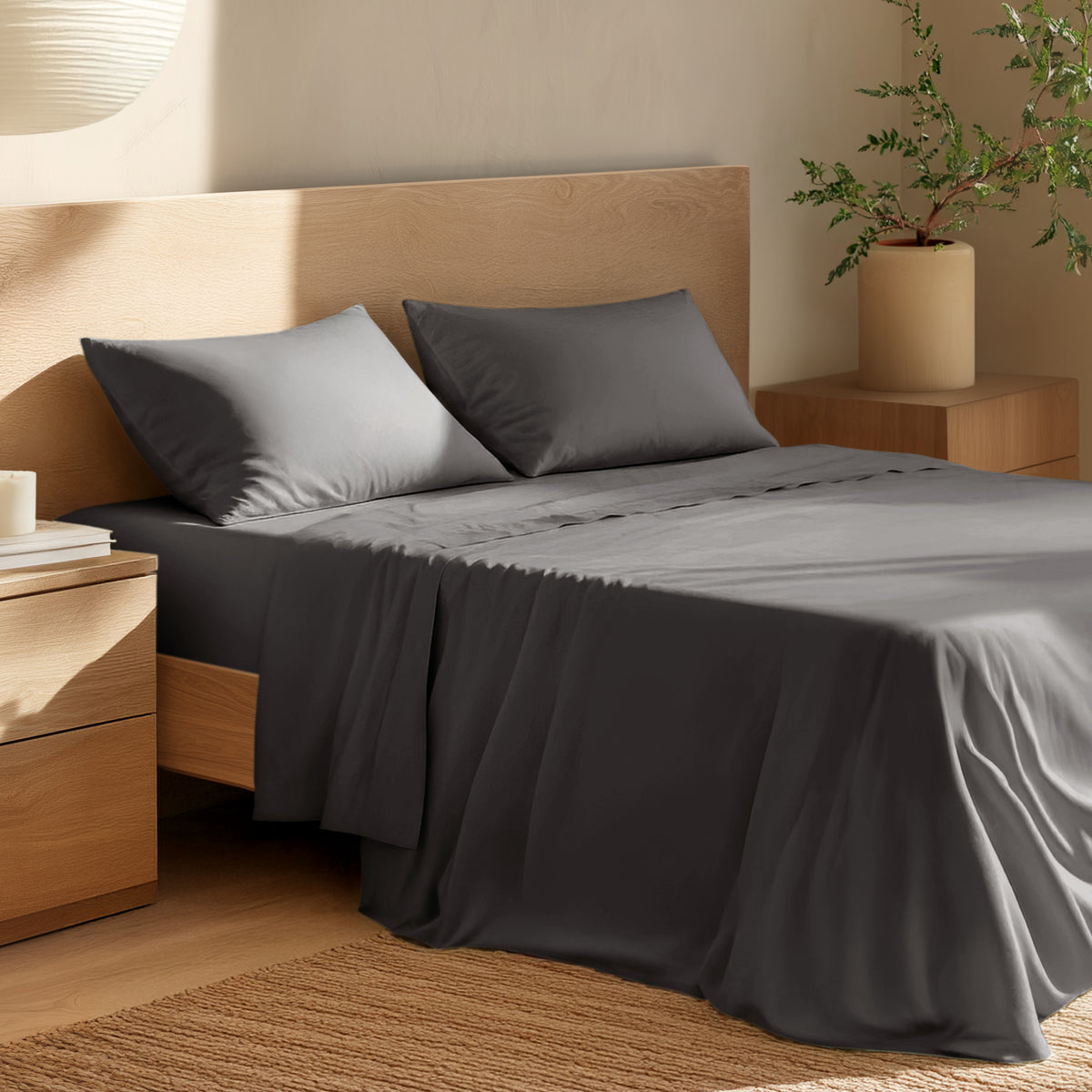 Bed with percale bedding and wooden headboard in a bedroom setting