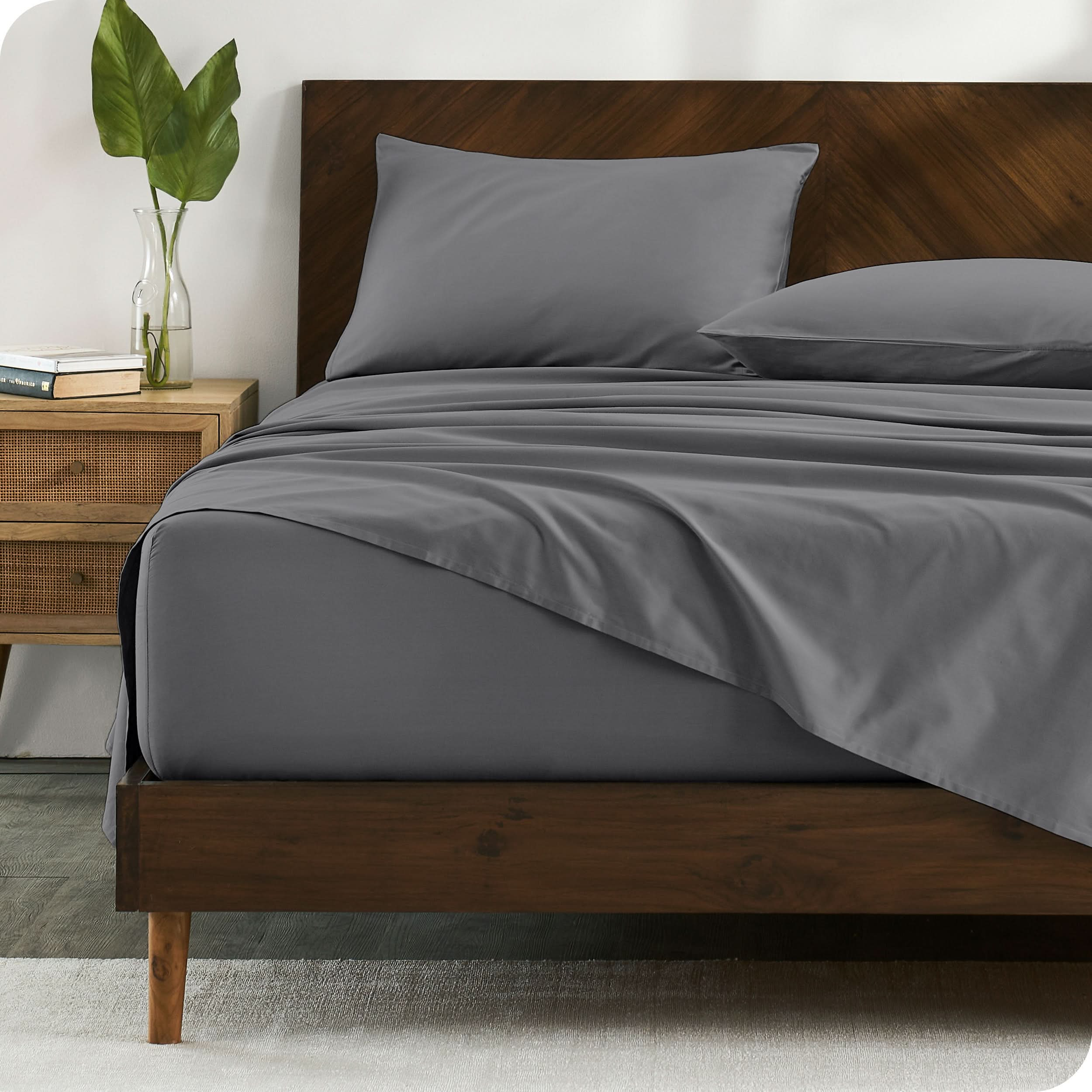 Modern wood bed made with percale sheet set