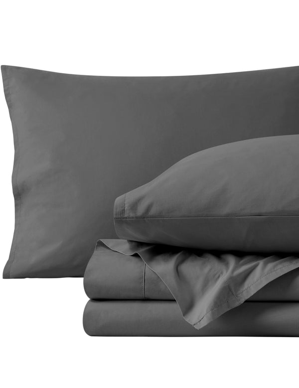 Percale sheets folded and matching pillowcases with pillows in them