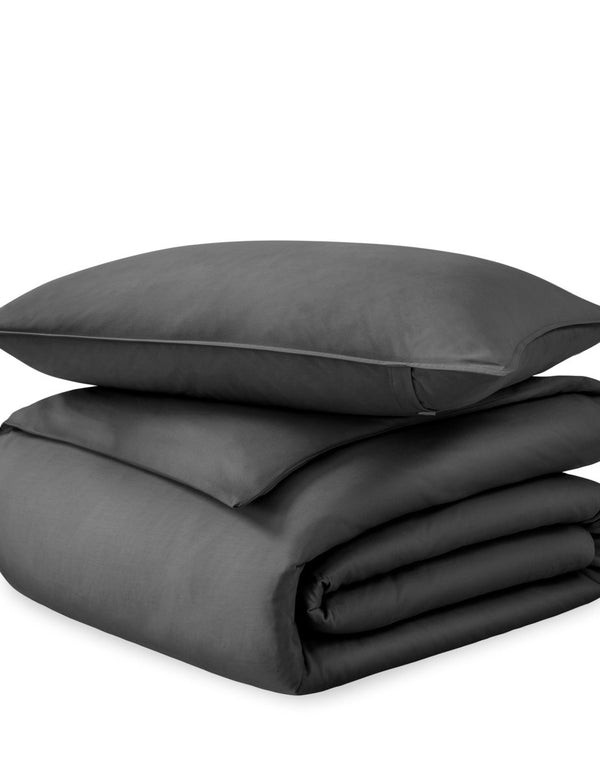 A sateen duvet set arranged in a stack