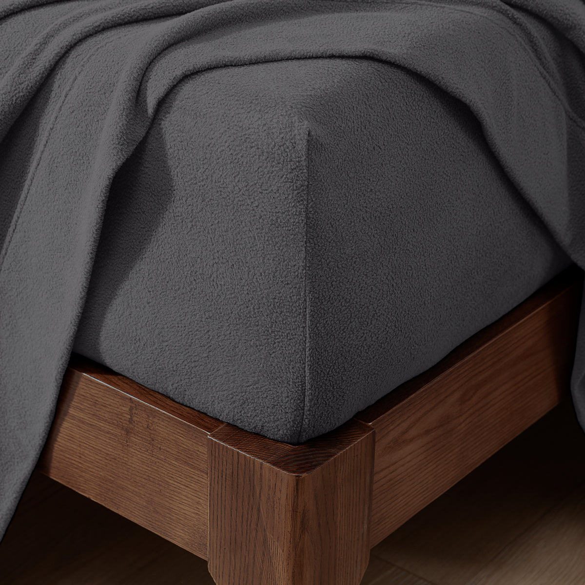 Fitted sheet on a wooden bed frame