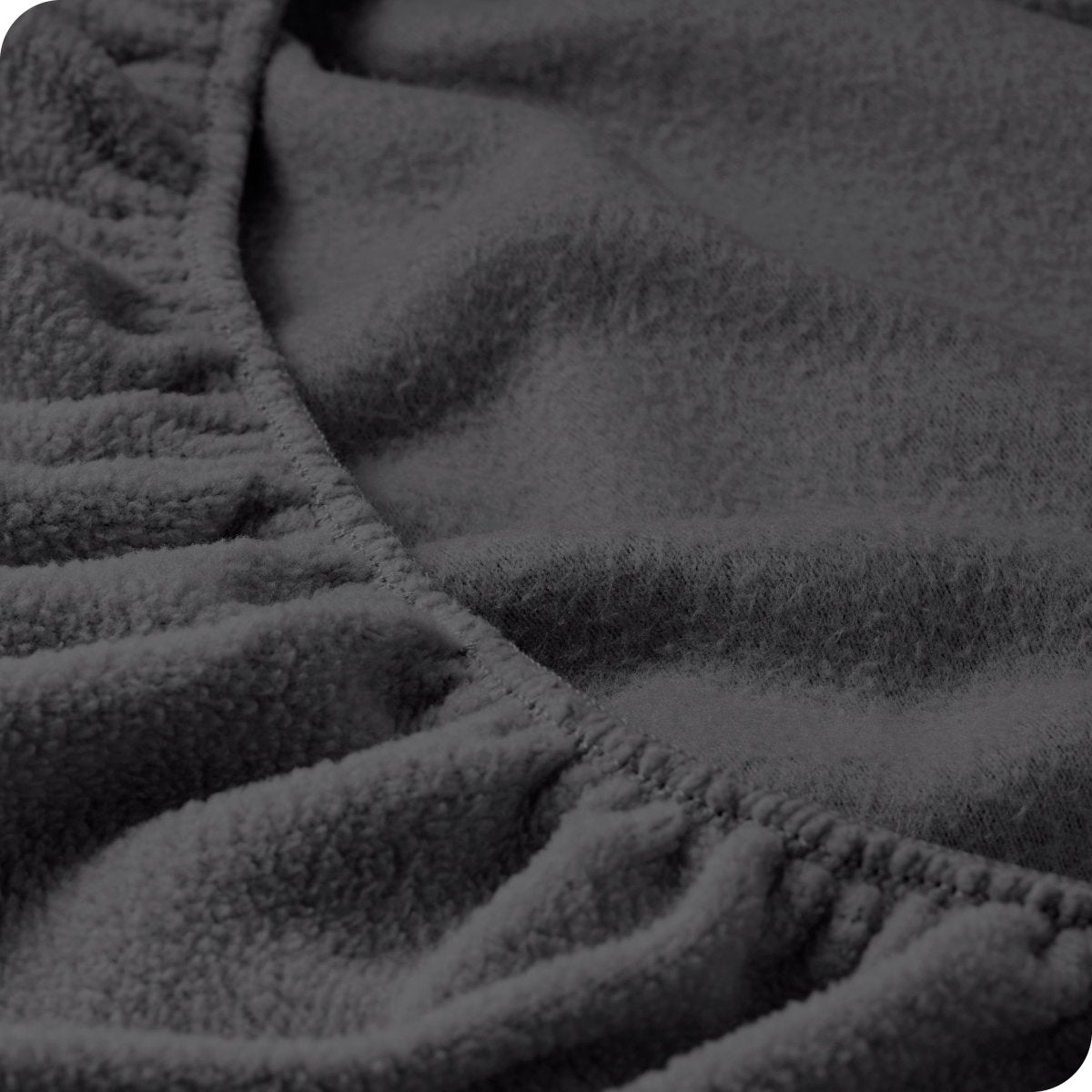 Close up of the elastic portion of a fleece fitted sheet