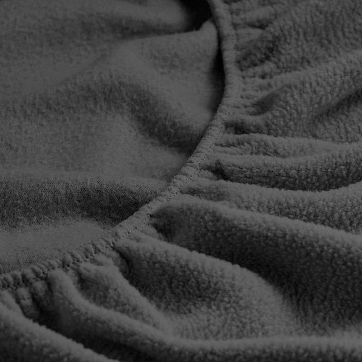 Close-up of a fitted sheet with all around elastic