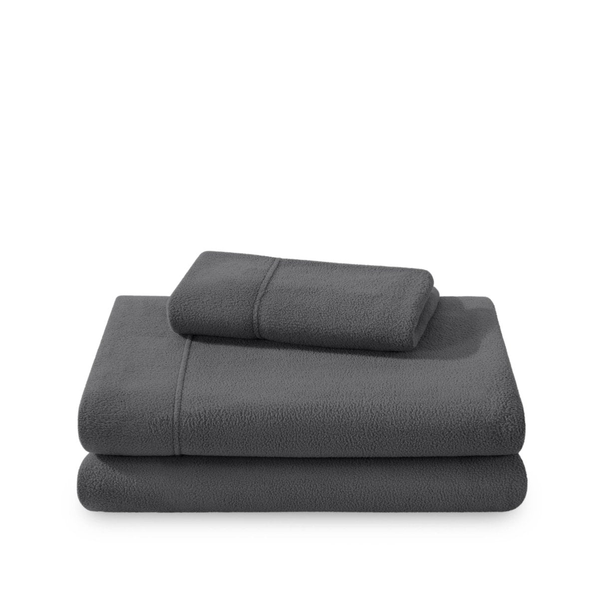Polar fleece sheets and pillowcases folded and stacked on a white background