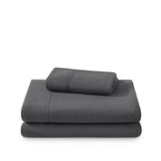 Polar fleece sheets and pillowcases folded and stacked on a white background