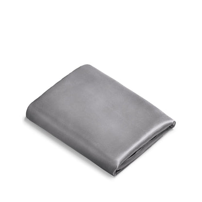 Folded satin pillowcase on a white background