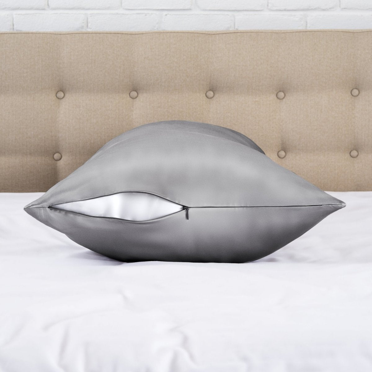Zipper closure satin pillowcase on a bed