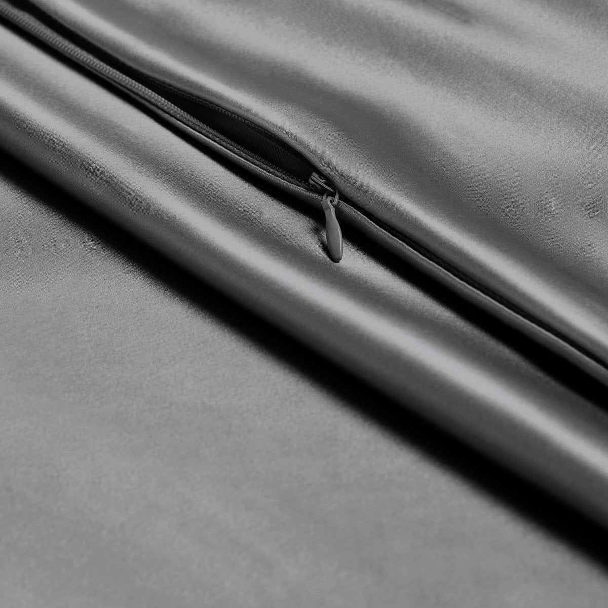 Close-up of a zipper closure on the satin pillowcase