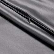Close-up of a zipper closure on the satin pillowcase