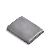 Folded satin pillowcase on a white background