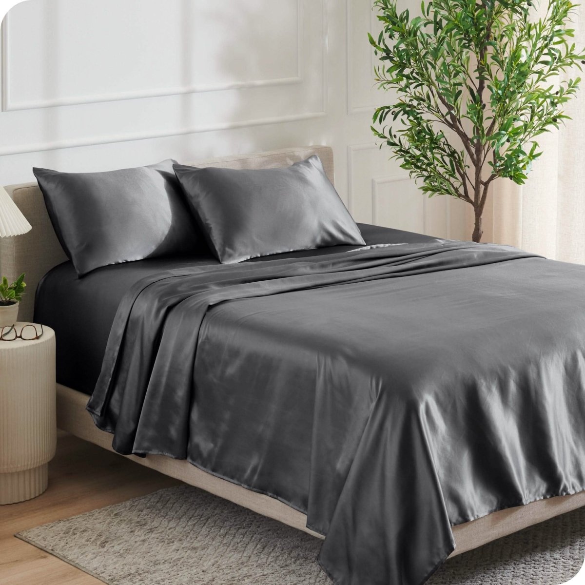 Satin sheets on a bed