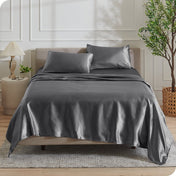Satin sheets draped over a mattress