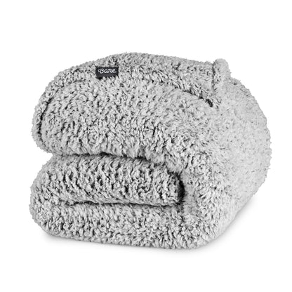 Folded sherpa blanket with a Bare label on a white background