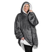 An adult with a sherpa wearable blanket on