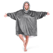 An adult with a hooded wearable blanket on
