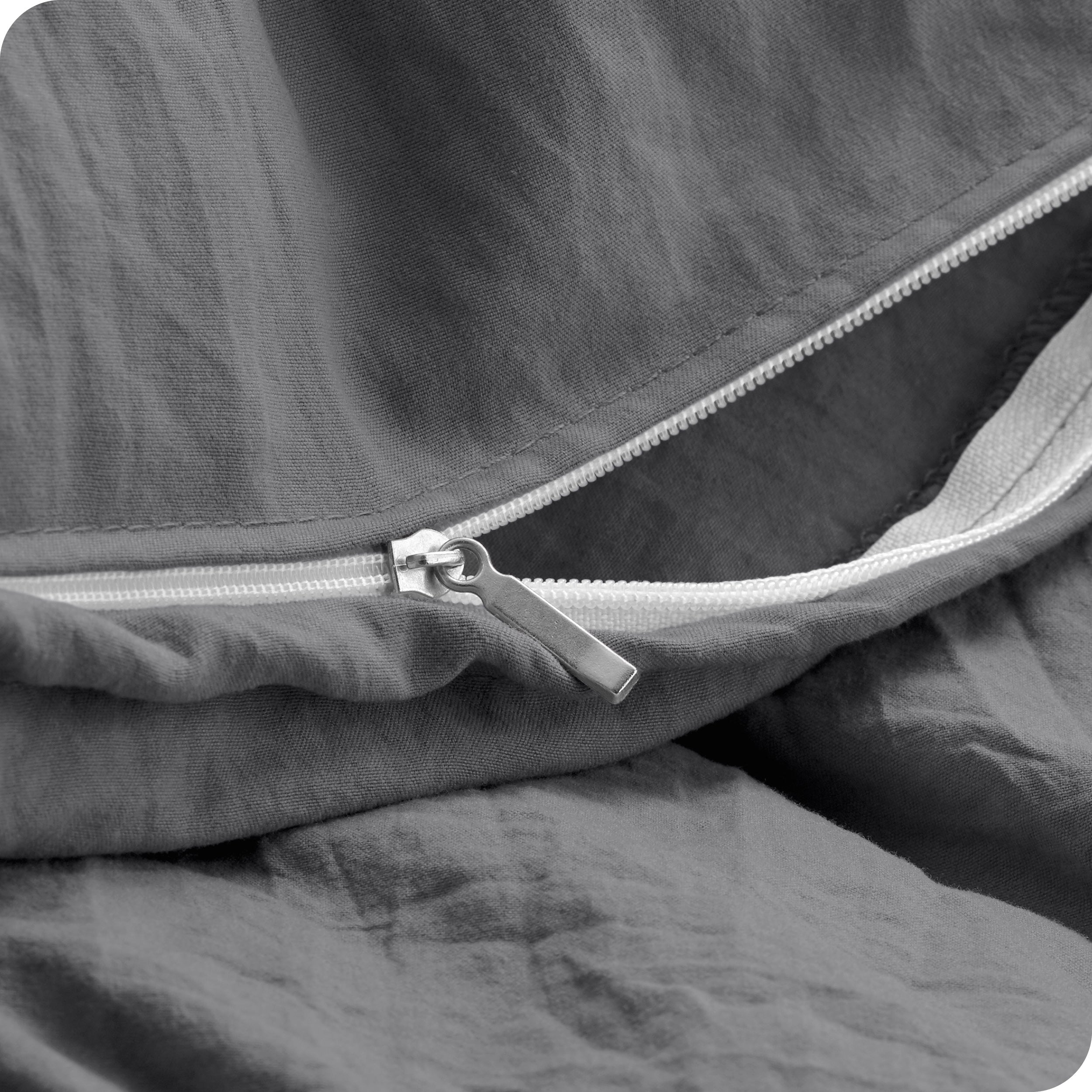 Close up of the zipper on the duvet cover partially opened